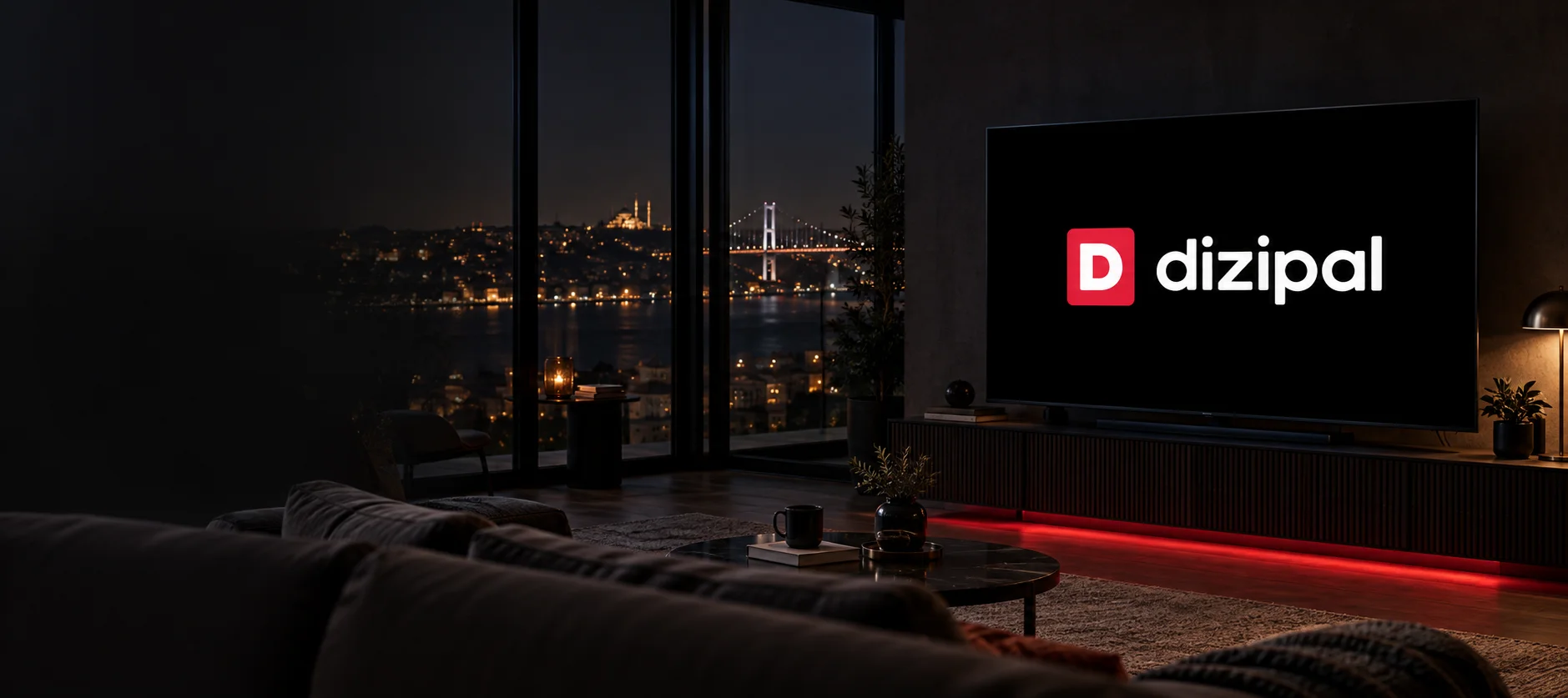 Gece İstanbul manzarasına açılan salonda kırmızı D ve beyaz dizipal yazılı televizyon